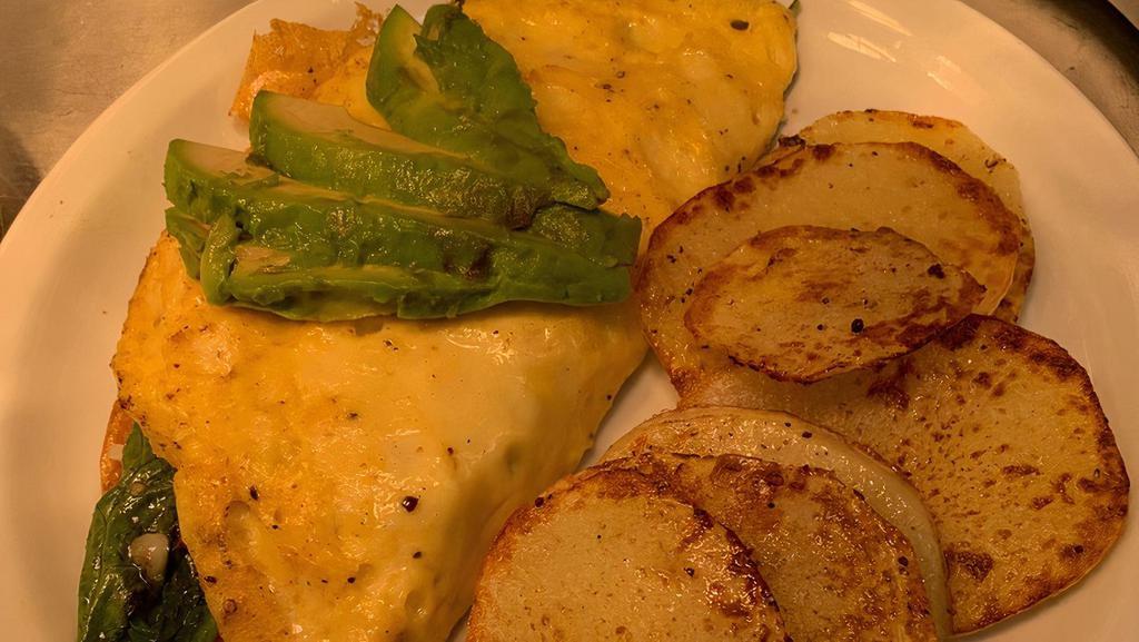 Omelet · Vegan egg, filled with cheese, onions, tomato, red peppers, spinach, topped with sliced avocado served with breakfast potatoes (gluten free). Served with tivoli salad and potato medallions