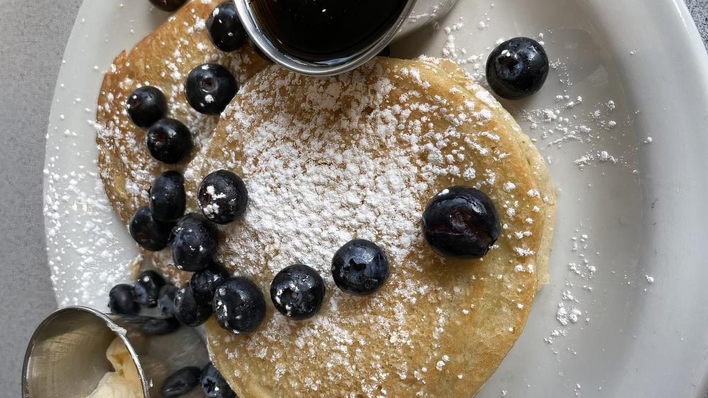 Pancakes · Vegan and gluten-free pancakes; powdered sugar, butter, maple syrup with a choice of strawberry, blueberry, banana, or chocolate chip toppings