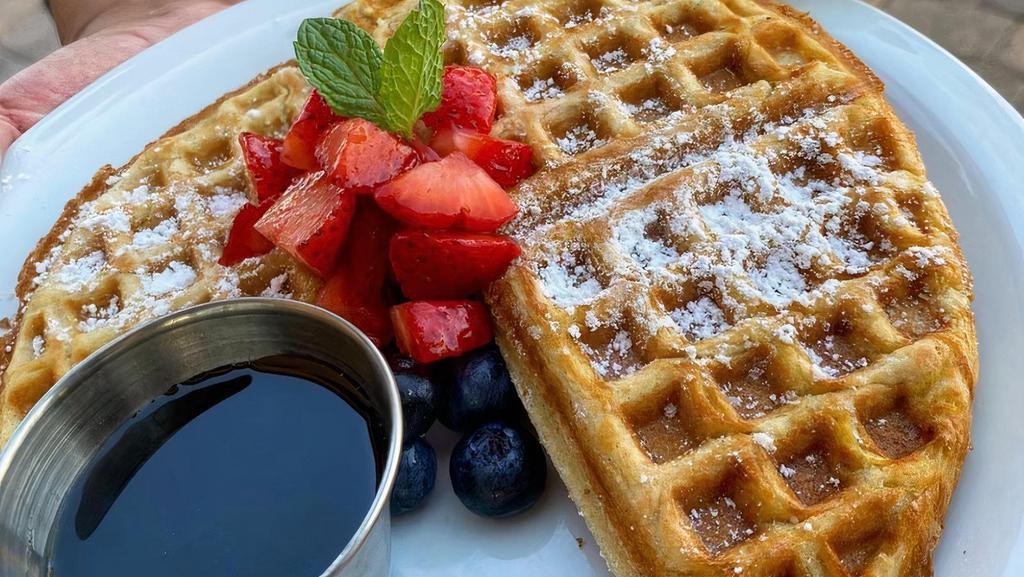 Waffles · Vegan and gluten-free waffles; powdered sugar, butter, maple syrup, with a choice of strawberry, blueberry, banana or chocolate chip topping