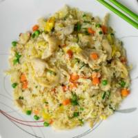 Pineapple Chicken Fried Rice · With carrot & peas.
