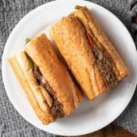 Empire Steak Sandwich · Thinly sliced beef, grilled bell peppers, mushrooms, onions, melted provolone and American c...