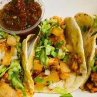 Chicken Tacos · 3 Chicken tacos topped with shredded cabbage, chopped tomato, onion, cilantro  erved with sa...