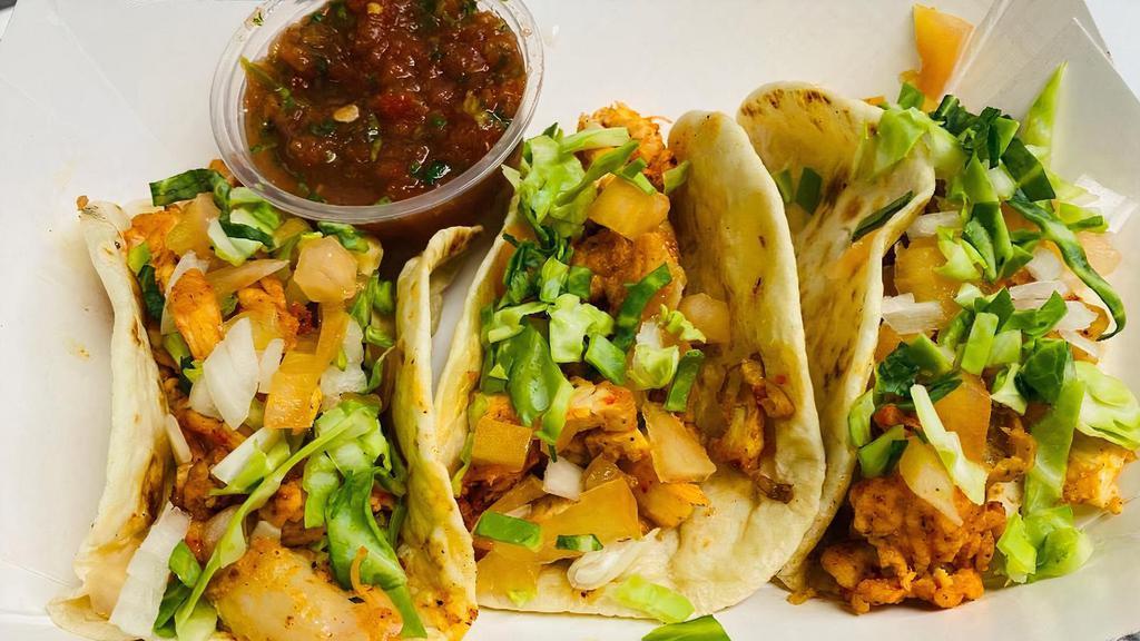 Chicken Tacos · 3 Chicken tacos topped with shredded cabbage, chopped tomato, onion, cilantro  erved with salsa.