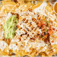 Nachos To Share · Chicken, beef or lamb, corn, pico de gallo, guacamole, queso fresco, house salsa.