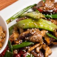 Mongolian Beef · Signature item. Thinly sliced beef, shiitake mushrooms, red chili peppers, onion sticks, pea...