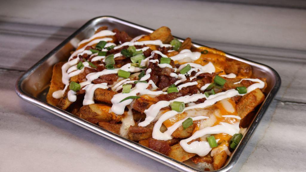 Loaded 414 Fries · Our amazing battered fries, smothered in chitpotle cheese sauce and melted mozzerella, topped with bacon, sour cream, and green onions. So delish