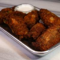 Red Hot Chili Poppers (Jalapeno) · Fresh jalapenos hand breaded, then stuffed with delectable cream cheese made fresh daily