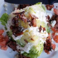 Wedge Salad · Classic wedge, 1/4 head of iceberg, blue cheese crumbles, diced tomatoes, bacon, blue cheese...