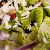 House Salad · Crisp romaine, spring mix, tomatoes, onions, mozzarella, black olives, green peppers, mushro...