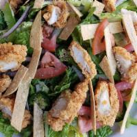 Southwest Caesar · Fresh romaine with crispy chicken, tomatoes, green peppers, and house made Southwest Caesar ...