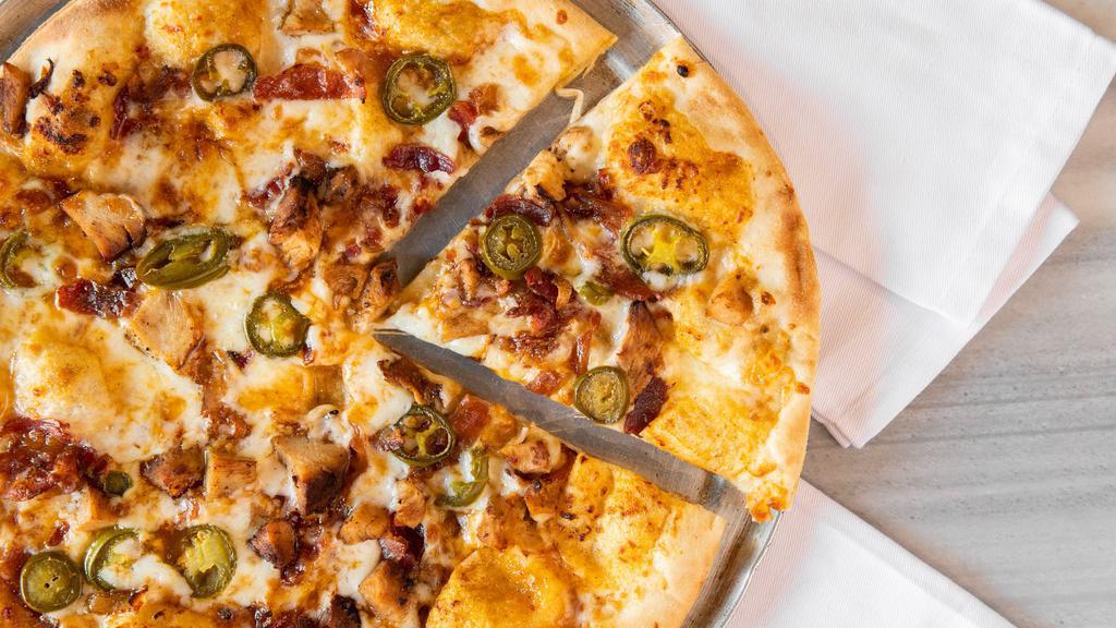 Spicy Bbq Pizza · BBQ sauce base, grilled chicken, bacon, and jalapeno.
