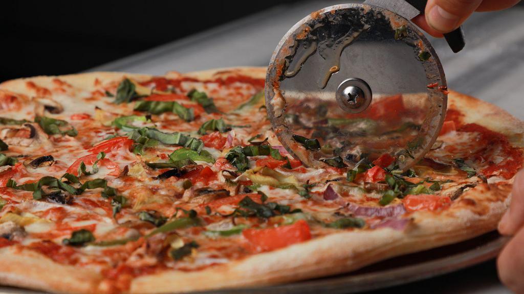 The Garden Pizza · Artichokes, red onions, green peppers, mushrooms, black olives, tomatoes, and spinach.