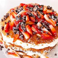 Strawberry Stack Pancakes · Daily Drip's three buttermilk pancakes served with fresh strawberries, chocolate chips, mapl...