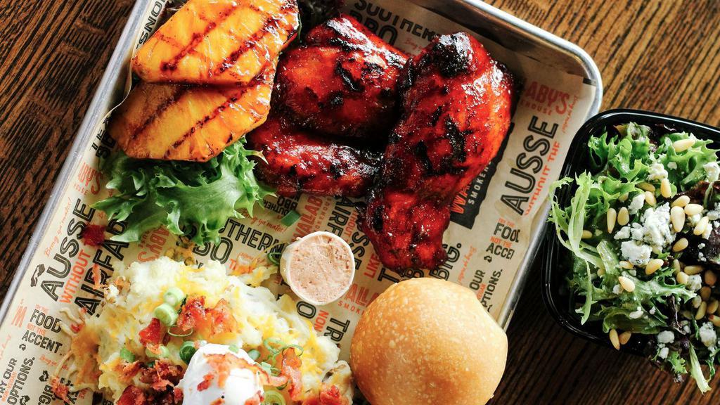 Pineapple Ginger Smoked Chicken · Perfectly Smoked Chicken finished on the Grill with caramelized Pineapple Ginger BBQ Sauce. Served with 2 sides of your choice and a fresh roll!
