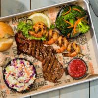Beef N' Reef · Four shrimp grilled with savory butter sauce and 1/4 pound of our tri-tip steak medallions.