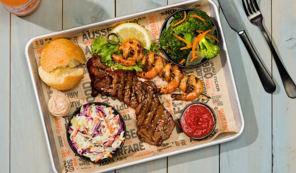 Beef  N’ Reef · Four shrimp grilled with savory butter sauce and 1/4 pound of our tri-tip steak medallions. Served with 2 sides of your choice and a fresh roll