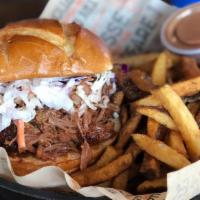 Bbq Pork Sanger · Enjoy a true BBQ classic. Topped with our signature coleslaw.