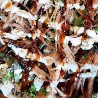 Bob’S Beef Brisket Salad · Smoked beef brisket, Parmesan, gorgonzola and roasted pine nuts on mixed greens topped with ...