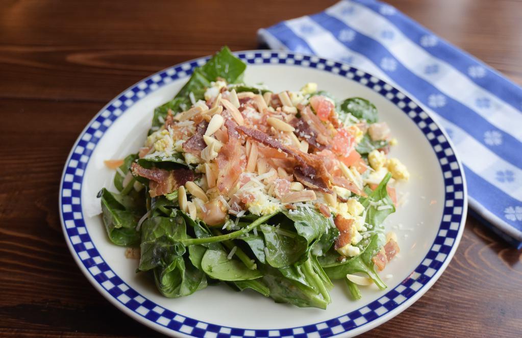 Plenty Of Iron Spinach Salad · Gluten-free. Sweet caper vinaigrette, nitrite-free bacon, toasted almonds, egg, diced tomatoes, Parmesan/Asiago cheeses.