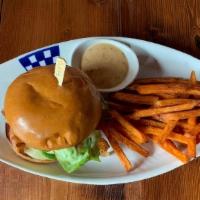 Crab Cake Patty Duke Sandwich · Dungeness crab uncake on essential baking co. Brioche bun, melted Havarti, bacon, chipotle a...