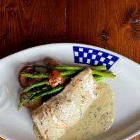 Colonel Mustard Wild Salmon · Pan seared Wild Alaksa Salmon with organic herbs and served with a French Dijon cream sauce