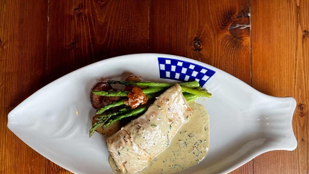 Colonel Mustard Wild Salmon · Pan seared Wild Alaksa Salmon with organic herbs and served with a French Dijon cream sauce