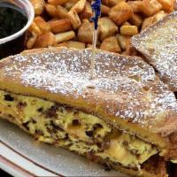 Stuffed French Toast · Scrambled eggs with cheese and your choice of ham, bacon, or sausage stuffed between French ...