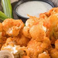 Buffalo Cauliflower · Fresh cauliflower hand battered in our signature buffalo sauce,
served with house made ranch...