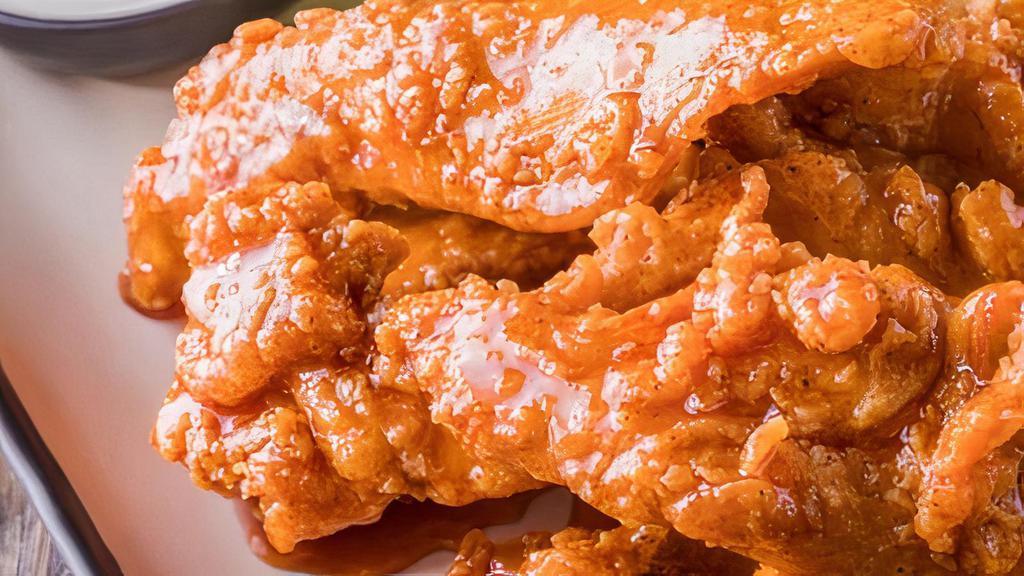 11 Sticky Fingers · Hand-breaded boneless chicken fingers smothered
in the Signature Sauce or Signature Rub
of your choice.