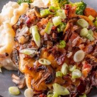 The Loaded Bird · Two grilled chicken breasts loaded with Double Barrel BBQ sauce topped with sharp cheddar ch...