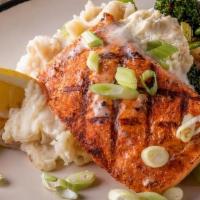 Broiled Lemon Salmon · Atlantic Salmon filet broiled with lemon butter served with red skin mashed potatoes and sau...