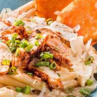 Blackened Chicken Alfredo · Parmesan alfredo tossed with penne pasta. Topped with Cajun grilled chicken and green onions...