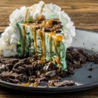 Asphalt Pie · Mint chocolate chip ice cream on an Oreo crust smothered in caramel sauce and topped with re...