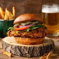 Fried Chicken Sandwich · Our classic fried chicken topped with pickles, romaine lettuce, sliced tomato, and house-mad...