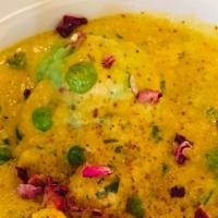 Bharwaan Gobi · Cauliflower stuffed with paneer and vegetables in a creamy cashew curry with a rose petal ga...