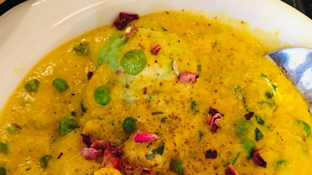 Bharwaan Gobi · Cauliflower stuffed with paneer and vegetables in a creamy cashew curry with a rose petal garnish.Rice Inchulde