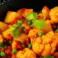 Aloo Gobi Matar · Cauliflower, potatoes, and peas cooked in a delicate blend of herbs with spices. Vegan, vege...