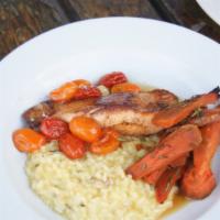 Pan Roasted Salmon · Salmon served with lemon risotto, honey roasted rosemary carrots and roasted tomatoes.