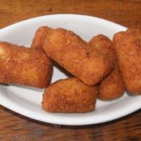Potato Croquettes · Tater Tots served with ketchup