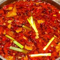 House Spicy Marrow Broth 特制香辣锅 · Chicken + beef bone marrow base broth, House chili
oil, red + green peppercorns, Sichuan dri...