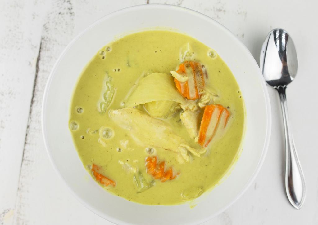 Yellow Curry · Yellow curry in coconut milk with chunks of simmered chicken breast potatoes carrots and onion.