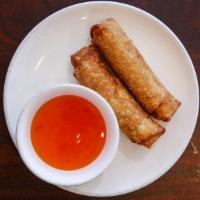 Egg Roll · Deep fried chicken egg roll with sweet sauce on the side.