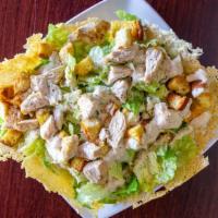 Caesar Salad · Fresh chopped romaine topped with caesar dressing, topped with homemade croutons served in o...
