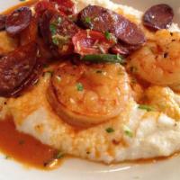 Cajun Shrimp & Grits · Creamy Cajun grits topped with cheese and sauteed onions and peppers, diced beef hot link an...