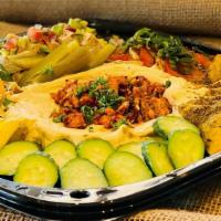 Mezze Platter · Happy Hour Tapas assortment: hummus & chicken with pine nuts, fresh mozzarella & tomato, bak...