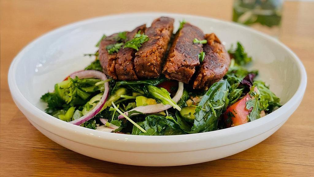 Grilled Hemp Steak Super Greens Salad · grilled and sliced southwest hemp steak, avocado, baby greens, seasonal mixed greens, tomatoes, cucumbers, bell peppers, red onions, sprouts, taboule, lemon vinaigrette