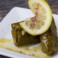 Dolmades · two grape leaves stuffed with rice, tomatoes, onions, parsley, red bell pepper, canola oil, ...