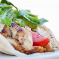 Mediterranean Roasted Chicken (Shawarma) · grilled marinated all-natural chicken breast, garlic sauce, tahini, seasonal mixed greens, t...