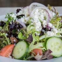 Greek Salad · seasonal mixed greens, tomatoes, cucumbers, red onions, feta, kalamata olives, lemon vinaigr...