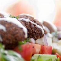 Falafel Salad · chickpea croquettes, seasonal mixed greens, tomatoes, cucumbers, red onions, pickles, tahini...
